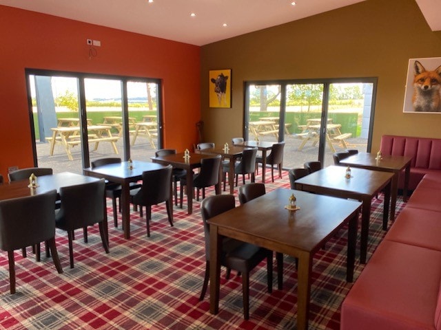 Bright dining room with views over the outdoor seating area